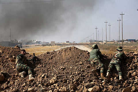 Kurdish security forces take up a position as they fight overlooking the Islamic State-controlled in villages surrounding Mosul, in Khazer, about 30 kilometers east of Mosul, Iraq. (File Photo | AP)