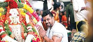 Still from the film Bharjari; (below) the actor shooting in front of the 24-foot statue  of Lord Lakshmi Narasimha Swamy