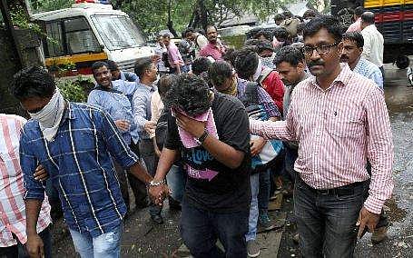 Call centre staffers who have been arrested for cheating loan defaulters in the United States, in Thane, Mumbai on Wednesday | PTI
