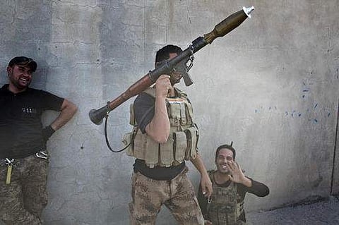 An Iraqi special forces soldier holds a rocket propelled grenade launcher in Bazwaya, some 8 kilometers from the center of Mosul | AP