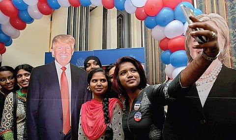 Students taking a selfie with a Donald Trump hoarding during  US Consulate General’s Prez poll day event in Chennai on Wednesday | Sunish P Surendran