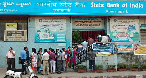 After the demonetisation of high value currency from Tuesday midnight, people queue up outside a bank in Kumara Park West, Bengaluru on Thursday to exchange them for fresh currency.(Manjunath S |EPS)