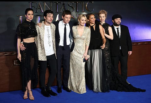 Writer J.K. Rowling poses with members of the cast as they arrive for the European premiere of the film 'Fantastic Beasts and Where to Find Them' at Cineworld Imax in London. (Reuters)