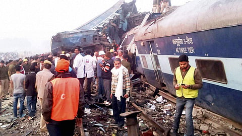 Rescue officials on the spot where 14 coaches of the Indore-Patna express derailed, killing 120 people in Kanpur's Dehat district on November 20. (Photo | PTI)