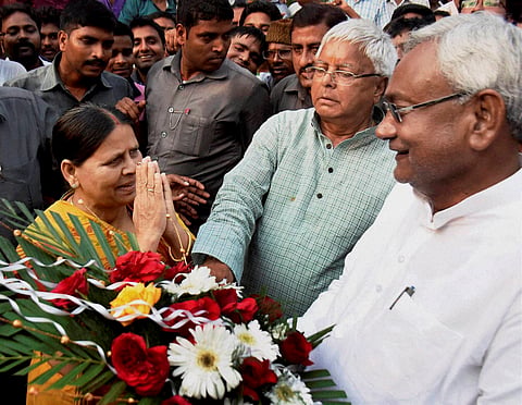 Bihar Chief minister Nitish Kumar RJD chief Lalu Prasad C and Rabri Devi exchange greetings after Mahagathbandhan's Grand Alliance victory in Bihar assembly elections in Patna on Sunday. | PTI