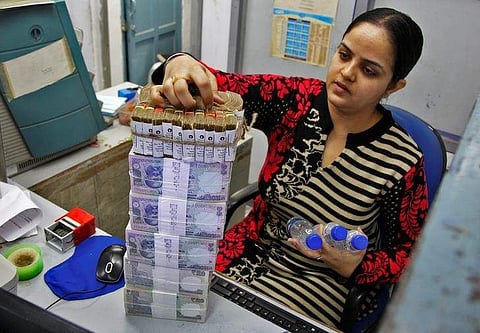 A cashier stacks Indian currency notes inside a bank in Chandigarh, November 19, 2016. | Reuters