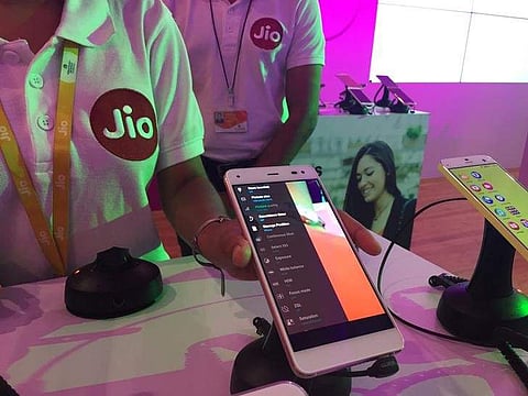 A Reliance employee demonstrates Jio LYF phone at their headquarters on the outskirts of Mumbai, India, June 1, 2016. | Reuters