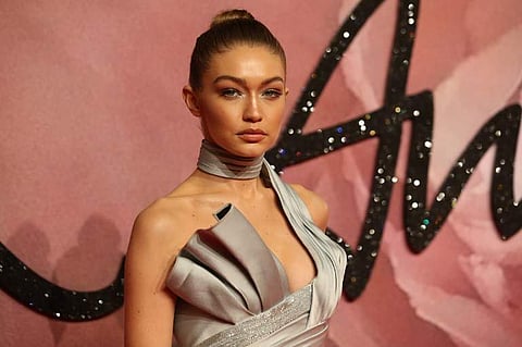US model Gigi Hadid poses for pictures on the red carpet upon arrival to attend the British Fashion Awards. (Photo | AFP)