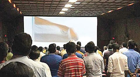People standing for national anthem in theatres after a recent ruling by the Supreme Court.