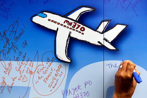 Well wishes are written on a wall of hope during a remembrance event for the ill fated Malaysia Airlines Flight 370 in Kuala Lumpur, Malaysia. (AP)
