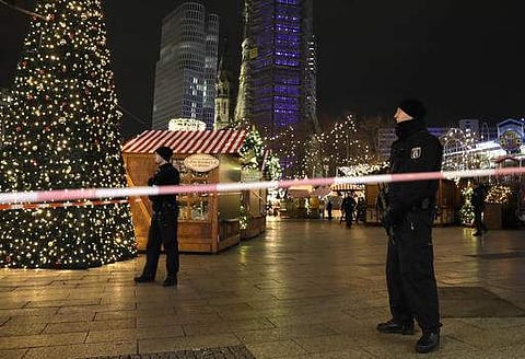 Police guard a Christmas market after a truck ran into the crowded Christmas market in Berliin Berlin, Germany. (AP)