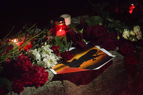 Flowers and candles are placed in memory of victims of the crashed plane in the center of Sochi, Russia, Sunday, Dec. 25, 2016. | AP