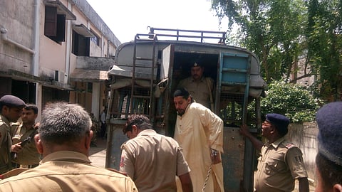 In this file image Abdul Rehman is seen being taken for production before JMFC, court, Salepur in Cuttack 