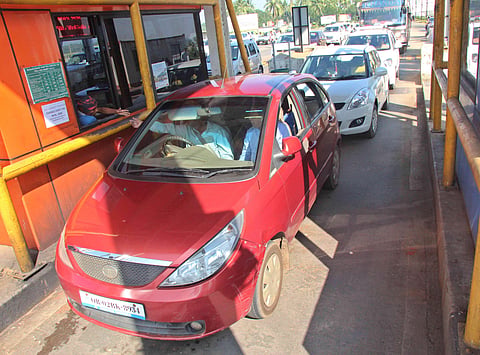 The FASTag employs radio frequency technology and allows automatic deduction of toll charges, without the motorist having to stop for payment. A scene at the Aroor bypass toll. (Albin Mathew | EPS)
