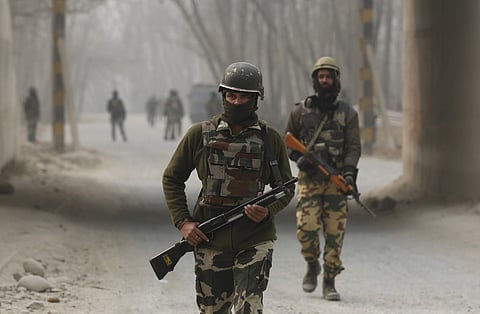 Indian soldiers block a road near the site of a gun battle at Arwani, 55 kilometers (34 miles) south of Srinagar. (Photo | AP)