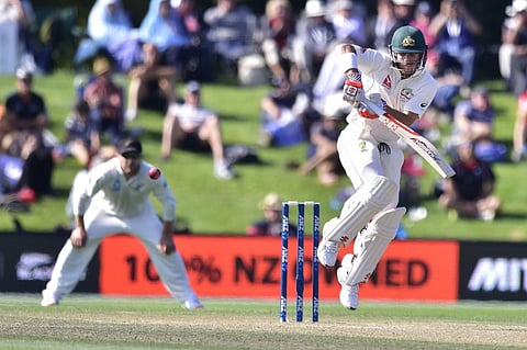 Australia's David Warner (R) plays a shot watched by Brendon McCullum (L) captain of New Zealand during day four of the second cricket Test match between New Zealand and Australia at the Hagley Park in Christchurch. |AFP