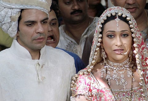Karisma Kapoor (R) and her new husband Sanjay Kapoor