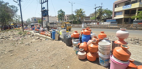 Colourful plastic pots kept in line for drinking water near ShahuChowk, Nanded road in Latur. Express Photo by A Radhakrishna