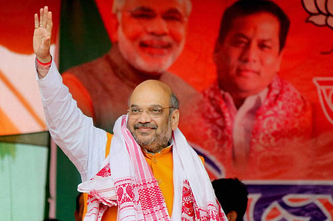 BJP National President Amit Shah waves ar the crowd at an election rally. (File | PTI)