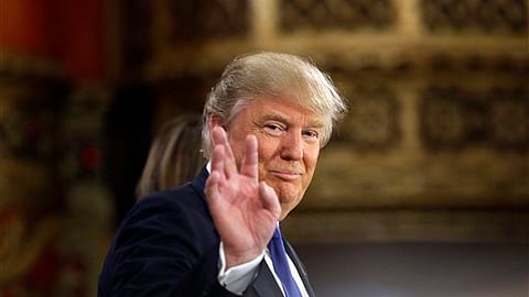 US president Donald Trump walks 
