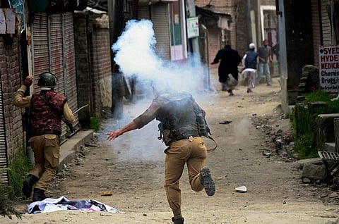 Police in action against the members of Tehreek-e-Hurriyat who were taking out a protest march against the killing of four persons in Handwara in Srinagar.