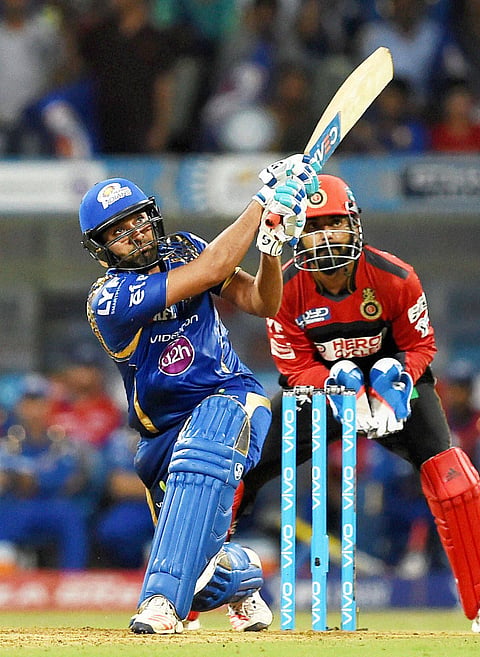Mumbai Indians player Rohit Sharma in action during the IPL match against Royal Challengers Bangalore in Mumbai on Wednesday. | PTI
