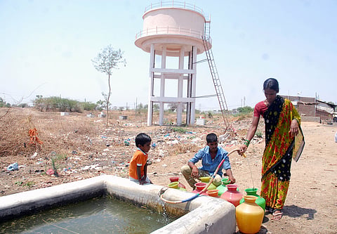 Villagers filling drinking water in plastic pots at a village in Mahabubnagar, one of the drought effected district in Telangana. 