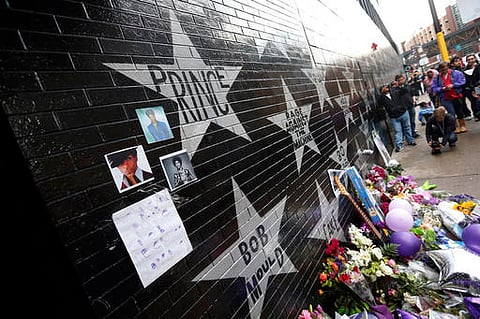 Prince's star adorns the wall at First Avenue as a memorial grew Thursday, April 21, 2016, in Minneapolis, where the pop super star Prince often performed | AP