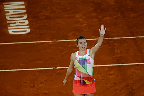 Simona Halep, from Romania, waves to supporters after winning the Madrid Open tennis tournament final match against Dominika Cibulkova, from Slovakia, in Madrid, Spain. |AP