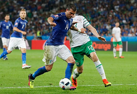 Italy's Stefano Sturaro, left, and Ireland's Stephen Ward go for the ball during the Euro 2016 Group E soccer match between Italy and Ireland at the Pierre Mauroy stadium in Villeneuve d’Ascq, near Lille, France, Wednesday, June 22, 2016. | AP