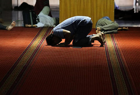 A Muslim man prays on the first day of the holy fasting month of Ramadan. |AP