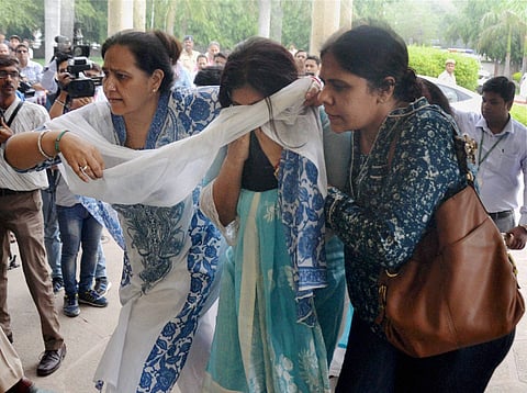 Inconsolable family members and parents of Tarishi Jain who was killed in the Dhaka terror attack after her body was brought for cremation in Gurgaon. | PTI