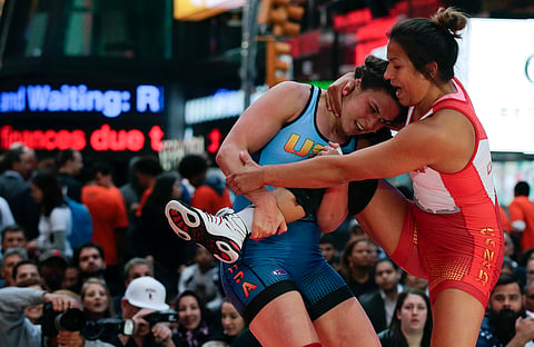In this May 19, 2016, file photo, Adeline Gray, left, attempts to take down Canada's Justina Di Stasio during the Beat the Streets wrestling exhibition in Times Square in New York. | AP