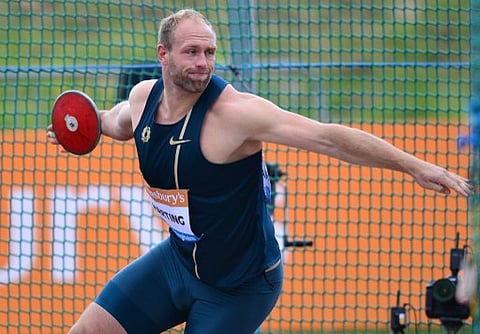 Germany's Robert Harting competes in the Men's Discus throw during the Diamond League Athletics meeting in Birmingham on August 24, 2014. | AFP