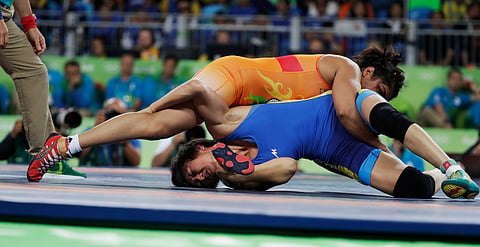 India's Sakshi Malik, top, competes against Kyrgyzstan's Aisuluu Tynybekova in the women's wrestling freestyle 58-kg competition at the 2016 Summer Olympics in Rio de Janeiro, Brazil, Wednesday, Aug. 17, 2016. (Photo|AP)