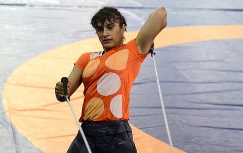 In this photograph taken on May 24, 2016, Indian wrestler Vinesh Phogat takes part in a practice session at a Sports Authority of India (SAI) gymnasium in Lucknow. | AFP