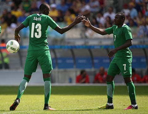 Nigeria's Sadiq Umar, left, celebrates scoring his side's 3rd goal with his teammate Umar Aminu during the bronze medal match of the men's Olympic football tournament between Honduras and Nigeria at Mineirao stadium in Belo Horizonte, Brazil, Saturday 