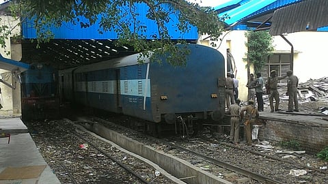 Police stand outside the Chennai bound Trichi Express train at Chennai Central railway station, after it was robbed. (P Jawahar | EPS)