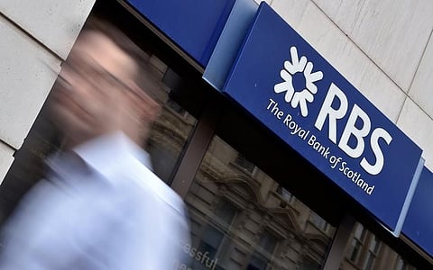 A man walks past a branch of The Royal Bank of Scotland (RBS) in central London, Britain. (File | Reuters)
