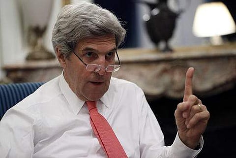 U.S Secretary of State John Kerry speaks with the media after attending the Mideast peace conference. | AP