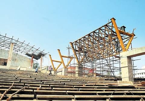 Workers busy erecting steel frames as renovation of Gurazada Appa Rao open air auditorium going on at  a brisk pace, in Visakhapatnam on Monday | Express