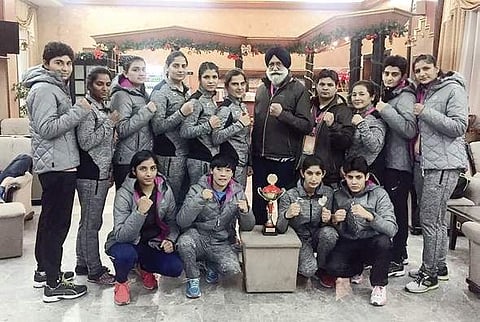 Indian women boxers celebrate their third-place effort in the recent event in Serbia