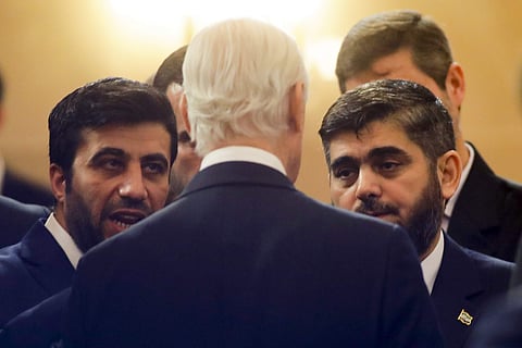 U.N. Special Envoy for Syria Staffan de Mistura, center back to a camera, speaks to head of Syrian opposition delegation Mohammed Alloush, right, prior to talks on Syrian peace at a hotel in Astana, Kazakhstan, Monday, Jan. 23, 2017.  | AP