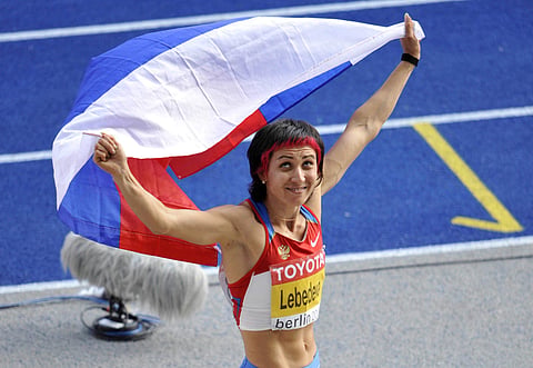 In this Sunday, Aug. 23, 2009 file photo silver medalist Russia's Tatyana Lebedeva reacts after the final of the Women's long jump during the World Athletics Championships in Berlin, Germany. | AP