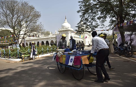 A bookseller takes around his mobile cart at the Hyderabad Literary Festival. | Vinay Madapui