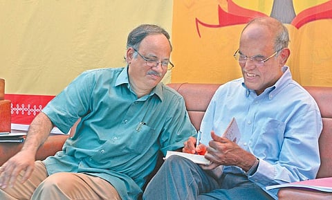 RBI former Governor D Subbarao having a word with Andhra Pradesh Planning Board vice-chairman C Kutumba Rao (left)  during a panel discussion on demonetisation at PWD Grounds in Vijayawada on Wednesday | Express