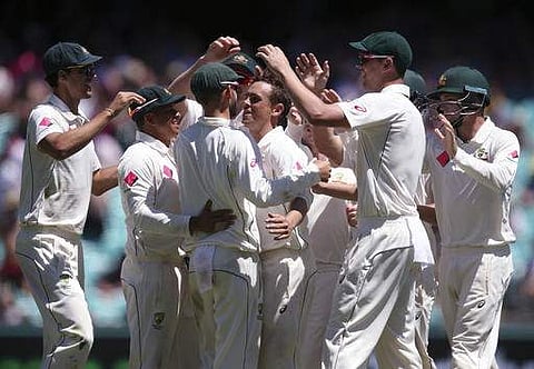 Australia celebrates the wicket of Pakistan's Misbah-ul-Haq during their cricket test match in Sydney. | AP
