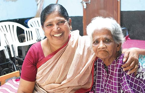Mary Esthappan with a patient at Abhaya Bhavan Express