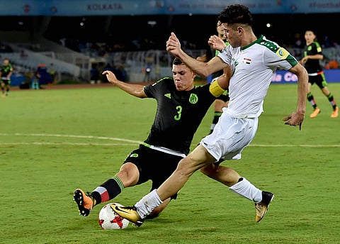 Iraq's player tackling Mexico in U-17 World Cup. (File photo | PTI)