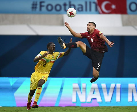 Players of Turkey and Mali Yellow in action during their FIFA U-17 World Cup football match in Mumbai on Monday. | PTI
